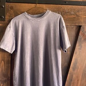 Abercrombie relax fit shirt. Runs a little long. More so large instead of medium